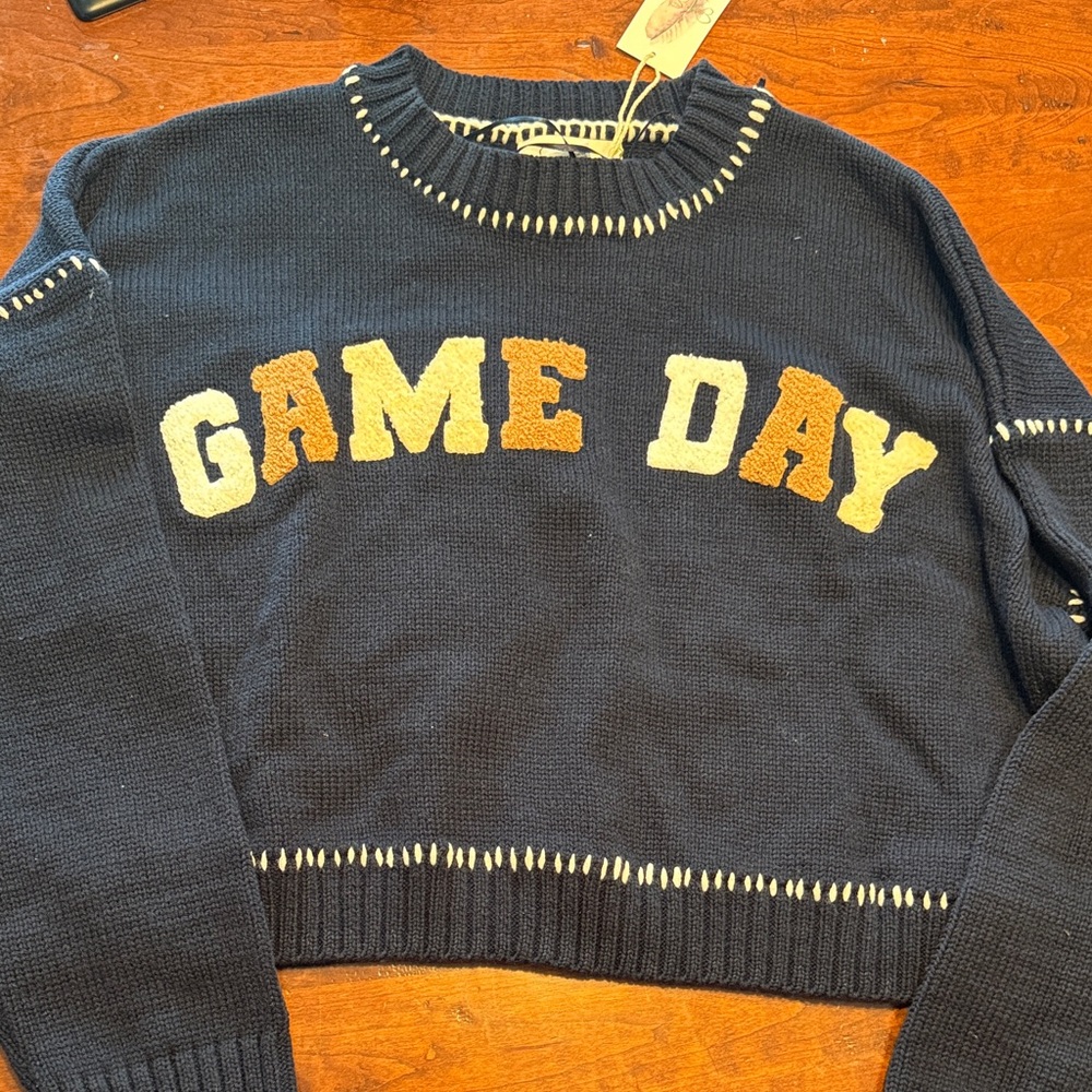 Jessica Simpson Navy Game Day Sweater Navy blue with white and tan letters.